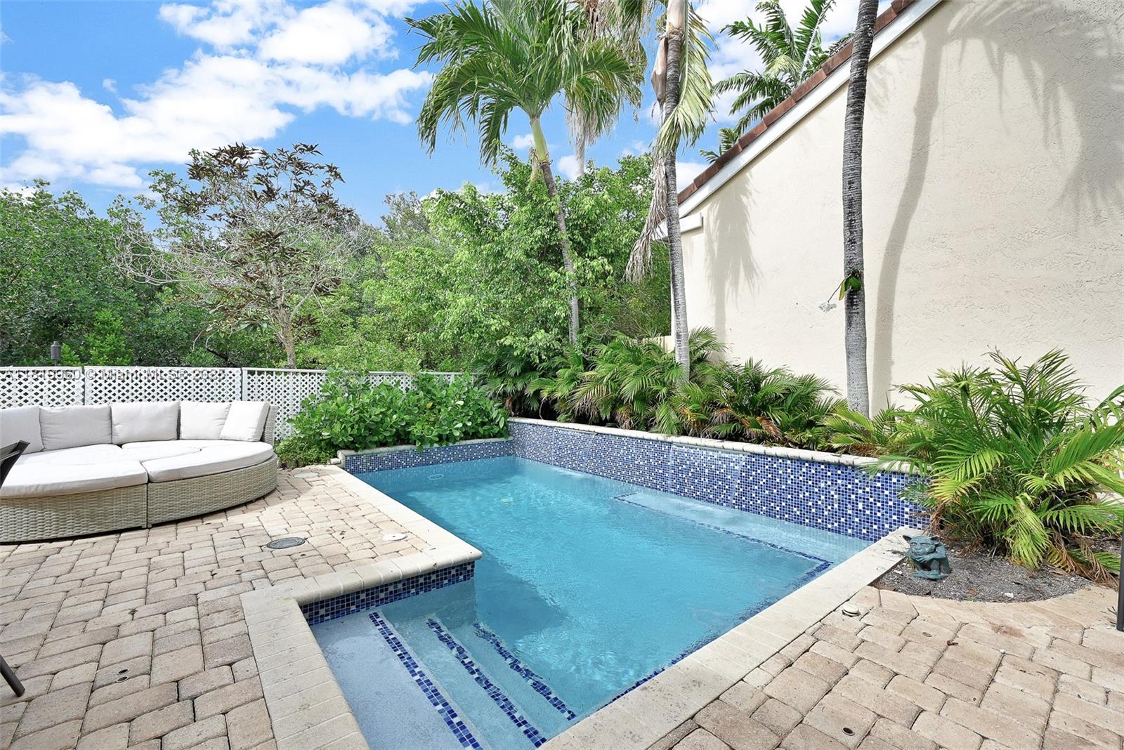 THIS HOME WITH POOL AND 2 CAR GARAGE SITS ON AN AMAZING CORNER LOT AND NO BACK NEIGHBORS! ALL IMPACT GLASS WINDOWS THROUGHOUT. HIGH CEILINGS IN THE LIVING ROOM AND DINING AREA WHICH LEADS INTO A HUGE FAMILY ROOM AND KITCHEN AREA THAT BOASTS BEAUTIFUL COUNTER TOPS, WOOD CABINETS, AND STAINLESS STEEL APPLIANCES. YOU HAVE ACCESS TO THE PRIVATE PATIO AREA FROM BOTH THE FAMILY ROOM AND THE LIVING ROOM. GORGEOUS POOL AREA WITH 2 FOUNTAINS AND AREAS TO SIT IN THE POOL. LOTS OF ROOM FOR ENTERTAINING/BBQ'S NEXT TO THE POOL AREA. THIS HOME HAS A FOUR CAR DRIVEWAY, UNIQUE IN WEST LAKE VILLAGE! WEST LAKE VILLAGE IS A GUARD GATED COMMUNITY 24/7 AND LOCATED JUST 1 MILE FROM THE BEACH. AMENITIES INCL 4 TENNIS CTS, 2 BASKETBALL COURTS, HEATED POOL, GYM, BB, KIDS PLAYGROUND.