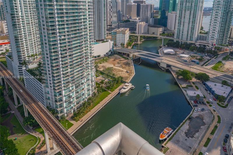 Amazing 2 story penthouse loft offering 868 sqft,1 bedroom, 1.5 bath in the heart of Brickell. As you enter this sun-filled open floor plan home you are greeted by floor to ceiling glass windows, sleek flooring, and a private balcony where you can enjoy sunrise and sunset views as boats ride along the Miami River. Enjoy cooking your favorite meals in the modern kitchen complete with stainless steel appliances, endless cabinets for storage, and ample counter space. Neo Vertika offers resort style amenities including a secure building offering 24/7 concierge, fitness center, infinity-edged swimming pool, hot tub, clubroom, cigar/library room, business center, racquetball court, & a sauna. You're steps away from Brickell City Center.Fully Furnished, has 2 parking spots, 1 valet & 1 self park.