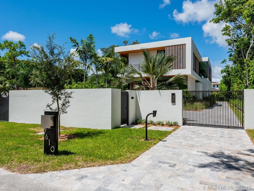 New tropical oasis in Ponce-Davis area. Designed by renowned architect Cesar Molina CMA Studio and executed with top finishes. Located on quiet dead-end street, this modern home sits on a 24,000+ sqft lot. Has 6 bed/6.5 baths and the best amenities: Elevator, pool with shallow beach + waterfall wall + Jacuzzi, Terrace with summer kitchen, 2nd family room upstairs, laundry room, dedicated office space, and large rooftop terrace with pool views & access to pool deck, adds 1,668 sqft of entertainment space. Italkraft kitchen with dining isle that sits 9. Sub-Zero appliances, wine coolers & Wolf range. Designer bathrooms with fixtures by Hansgrohe, Duravit & Jacuzzi. Built-in security system & much more! Stunning combo of family home and entertainer’s dream. Beautifully staged. A must-see!