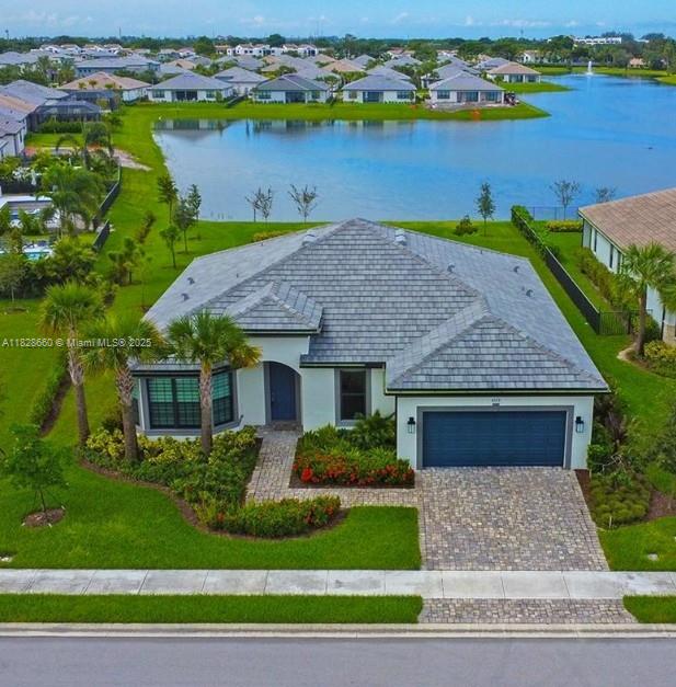 Welcome to a Beautiful Oak Tree community! 2023 construction home features the highly sought-after Stardom model, offering 3 spacious bedrooms, a versatile den, and 2.5 luxurious bathrooms. The beautifully upgraded kitchen boasts designer countertops, premium cabinetry, and elegant tile flooring throughout. High ceilings, impact windows, upgrade enhance the homes bright. This open and airy residence is move-in ready—completely empty and waiting for your personal touch and furnishings. Enjoy resort-style living with access to the exclusive Private Clubhouse, a gorgeous pool, private cabanas, fully equipped gym, and professional meeting spaces, start your next chapter in this exceptional home and new community!