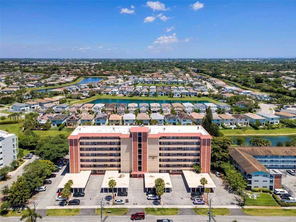Photo of 1101 Crystal Lake Dr #203, Deerfield Beach, FL 33064 (MLS # A12016396)