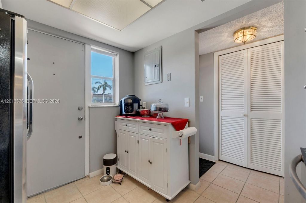 Photo of 1101 Crystal Lake Dr #203, Deerfield Beach, FL 33064 (MLS # A12016396)