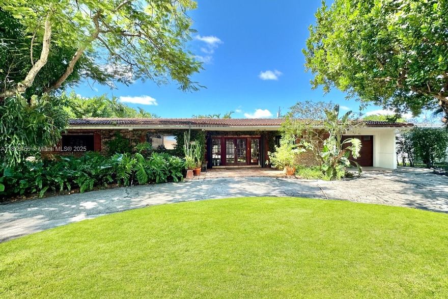 Charming home on prestigious Keystone Island Dr., surrounded by Bayfront neighbors! Set on a rare oversized 10,710 SF lot, this 3 Beds 2 1/2 Baths residence features a pool, covered patio, and insulated garage currently used as a laundry room. The spacious primary suite boasts French windows overlooking the pool, a walk-through closet, and ample natural light. Enjoy a bright kitchen with windows on both sides, impact windows throughout, and generous living spaces. A true gem offering comfort, character, and location in the heart of Keystone Point!