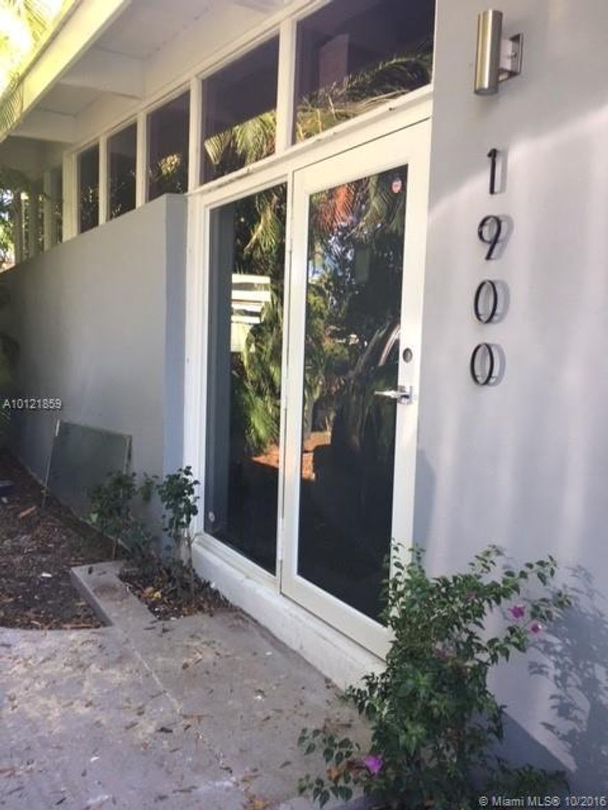 REDUCED!GATED COMMUNITY!!2 bedrooms 2 baths. NO HOA. Almost everything is brand new on this house, with New Hurricane proof windows and doors, New 2016 roof, high quality new cabinet kitchen with waterfall white quartz, appliances, sub zero 48" fridge, shower panel with digital temp, led shower head on master bath, HD Mirror with 19" hd tv on master that disappears when is off, modern open concept kitchen, new floors, new deck around the house and more. Must see to appreciate. Everything done with permits