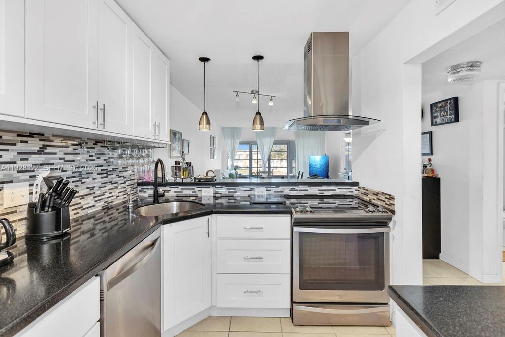 Photo of 6071 NW 61st Ave #303, Tamarac, FL 33319 (MLS # A11928122)