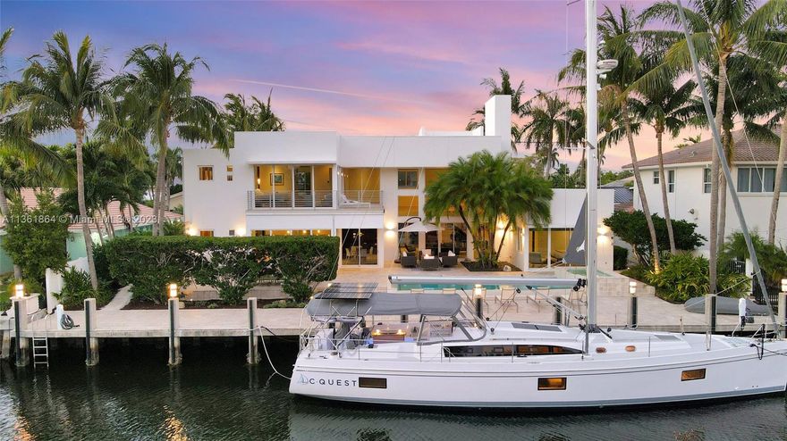 Calling all Yachtsmen & Entertainers! Welcome to your Contemporary Masterpiece in Coral Ridge Country Club Estates! Fully-loaded Chef’s kitchen w/ 8 burner Wolf gas range, SubZero 46” wide fridge, & Miele built-in coffee maker & steam oven, all adjacent to your 800+bottle temp-controlled wine room. Immense summer kitchen w/ Wolf gas grill, Wolf side burner, Big Green Egg, & fridge. Soaring 22’+ wall of windows showcases the resort style backyard w/ saltwater pool & spa w/southern exposure. 2 guest suites on main level, incl 1 junior primary, 3 bedrooms on 2nd floor including owner’s suite w/large balcony, walk-in closets, vanity, & spa bath w/ soaking tub & 4 function shower. 100’ concrete dock on a 115' wide waterway houses your up to 80’ yacht. Close to restaurants, shopping & the beach!