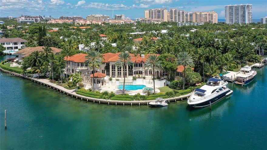 Private and prestigious waterfront estate featuring Panoramic views of Biscayne Bay and Pines canal. A dream property for the Yacht set, with 346 ft of water frontage & direct ocean access. The gated estate is one of the island’s largest, set on a lush 32,300 Sq.Ft lot, perfect for entertaining.  Designed with the finest attention to detail, the home is extremely spacious "16,076 sf total", including 9 Bd., 8 Ba., library, office, theater, bar, spa with sauna, gourmet kitchen, marble & brazilian hardwood floors, security cameras, Lutron lighting & more. Note: The adjacent house is also available for sale, offering an additional 250 ft of water frontage on a separate 23,724 sq ft lot
