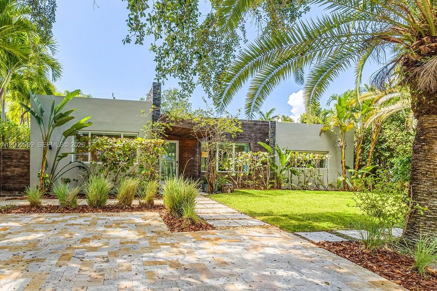 This remodeled home in gated Morningside leaves nothing to be desired. Enter into the large, open living space with floor-to-ceiling sliding glass doors that open to a pool deck with spacious, covered seating. The mature landscaping ensures privacy inside bedrooms. Enjoy contemporary features such as an open kitchen with Miele appliances and Corian countertops, vaulted ceilings with skylights throughout, new tile flooring, and a newly finished driveway. The master suite opens up to the saline pool, and offers a spacious walk-in shower and a free-standing tub. Convenient home automation features include keyless entry, Ring doorbell, and speakers and cameras inside and out. Located close to the 42-acre Morningside Park with tennis- and basketball courts, soccer field, boat ramp, and large kids playground. A new waterfront Baywalk is currently under construction. Only minutes to the Design District, Wynwood, Downtown, Miami Beach, and the airport. Available fully furnished for annual lease.