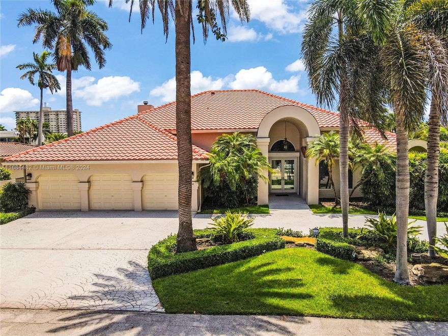 This modern, one-story home in Seven Isles is packed with luxurious upgrades, few including a new concrete seawall, dock, impact windows, doors and a 60KW natural gas generator. Renovated professionally, featuring an open layout with high ceilings. The home is situated on a prestigious 13,000 square foot lot and the home includes four bedrooms, four bathrooms, and a three-car garage. The master suite is enhanced with a fireplace, closets, and a luxurious bathroom. A formal dining room connects to a new kitchen with a center island, opening into a family room with a second fireplace. The living room, featuring a wet bar, leads to the pool deck. The neighborhood entrance has 24/7 security and is within walking distance to the beach, shops, and restaurants, with quick access to the ocean.