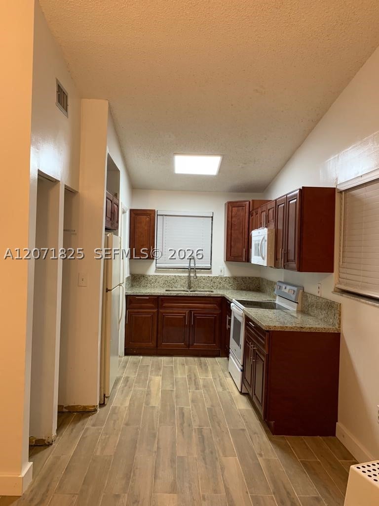 Photo of 1008 SW 8th St #1008, Hallandale Beach, FL 33009 (MLS # A12071825)