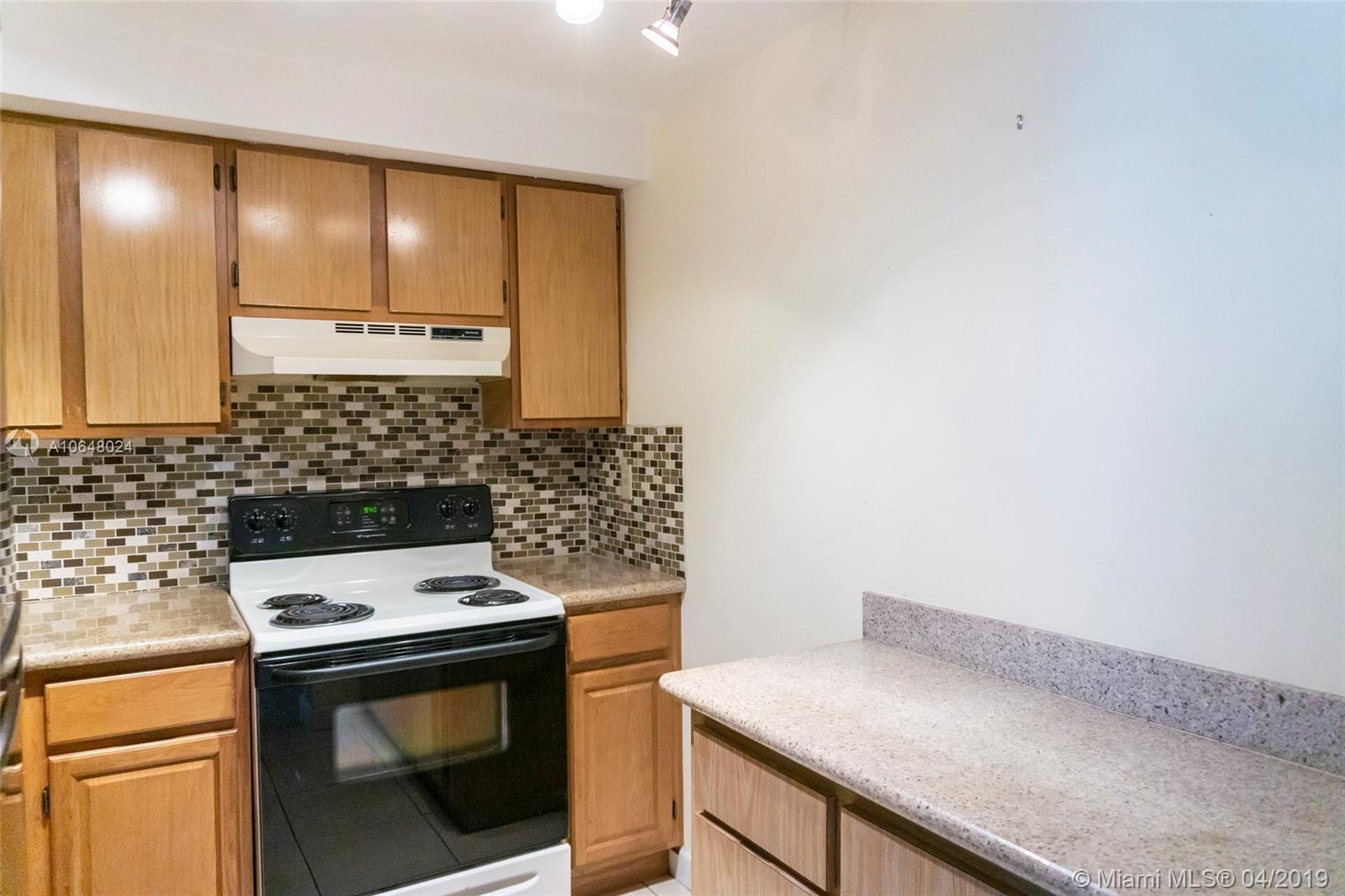 This well maintained third-floor corner unit features a split floor plan with two bedrooms, two full bathrooms, spacious living areas, and an open balcony. The kitchen has been updated with granite countertops and a mosaic glass tile backsplash. Washer and dryer are located inside the unit. The fenced complex features a huge pool and community room for residents. Conveniently located near the Turnpike, FIU, excellent private and public schools. restaurants, shopping, and public transportation. Great investment opportunity!
