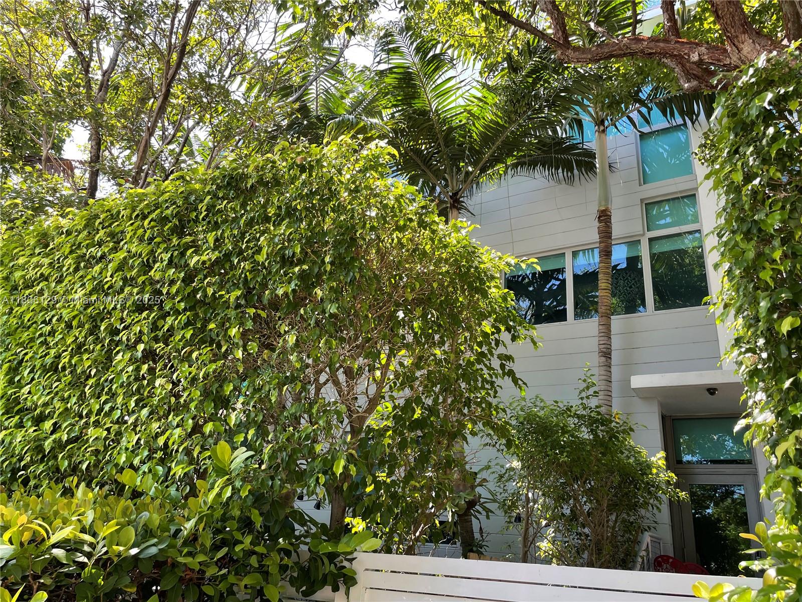 Fully remodeled Tri-level townhouse with 28 ft ceilings generating $5900 per month with brand new white porcelain plank floors throughout. Private rooftop terrace and hot tub. Quiet and secure building with only 7 units. Bright open living space. High Impact windows and doors, 2 bedrooms and 2 full baths. Includes 1 covered assigned parking in a gated garage. Feel at home in this gated, quiet and secure building. Unbeatable location within 2 blocks to the shopping center on Alton Rd and 5th Ave. Walk to Flamingo Park, the Beach, Lincoln Road, shops and restaurants. Publix, Total Wine and Whole Foods are just around the corner. This exclusive and private residence gives you the opportunity to enjoy luxury in a prime location without the hassle of high rise living. Very low Maintenance fees.