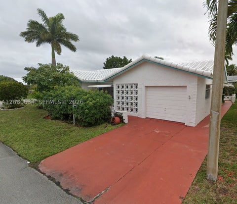 Photo of 7516 NW 67th Ave, Tamarac, FL 33321 (MLS # A12060634)