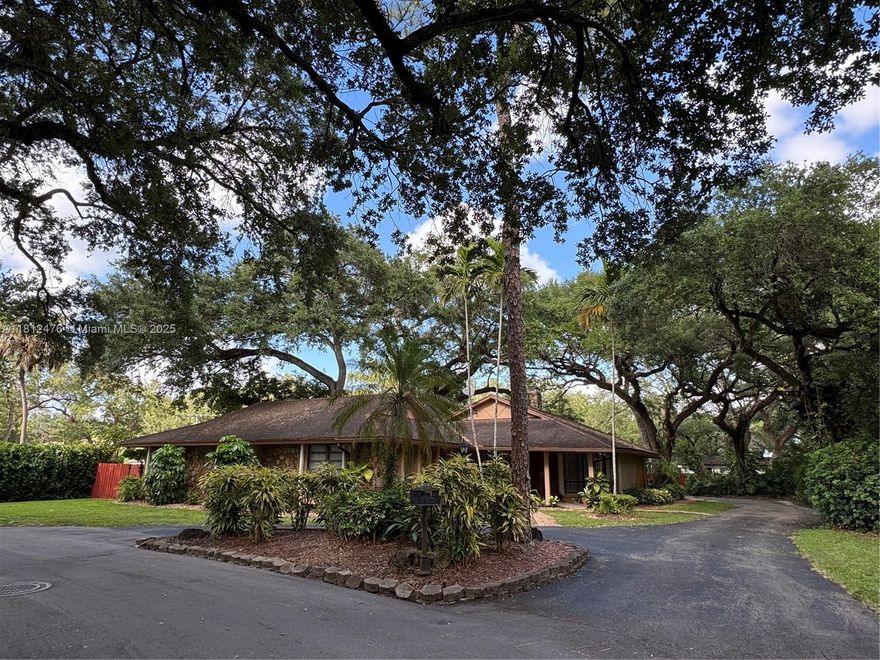 Great opportunity to own a well-maintained one-story home in Stirling Oaks Estates, located quiet cul-de-sac with beautiful oak trees. Seller financing available with 40% down—owner will hold first mortgage at 6.5% interest-only, 5-year balloon. Home features vaulted ceilings in entry, living, family, dining, breakfast rooms, & kitchen. Four bedrooms on one side plus a separate entrance to a 5th bedroom and full bathroom. Open kitchen with island, bar seating. Fireplace in living room/family room. Primary suite overlooks the pool and garden, with step-in shower & walk-in closet. Impact sliding doors only. 2-car garage plus 2-car carport. Oversized 0.41-acre lot with plenty of space. Walking distance to places of worship & schools; minutes to Hard Rock, Fort Lauderdale Airport, & shopping.