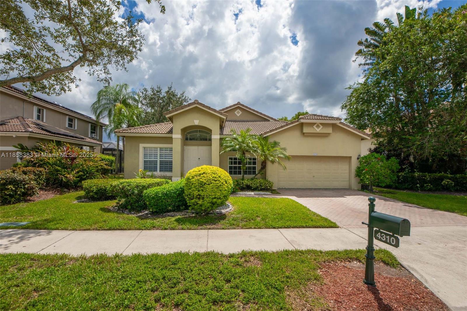 Welcome to a beautiful single family home 4-bedroom, 2-bathroom in Emerald Estates community in Weston. This residence features a spacious, open-concept layout with formal living, dining, and family rooms, with a 2 car garage and full size attic. The recently remodeled kitchen boasts a 50-bottle wine cabinet, catering to culinary enthusiasts. Enjoy serene lake views from the beautifully landscaped backyard, complete with palm trees, offering one of the best lake view in the community. The amenities include and 24/7 guard-gated security, club house, gym and a playground. Located within an A+ rated school district and walking distance to shops, restaurants, tennis courts, playground and more. This home is perfect for families seeking a private and stylish retreat.