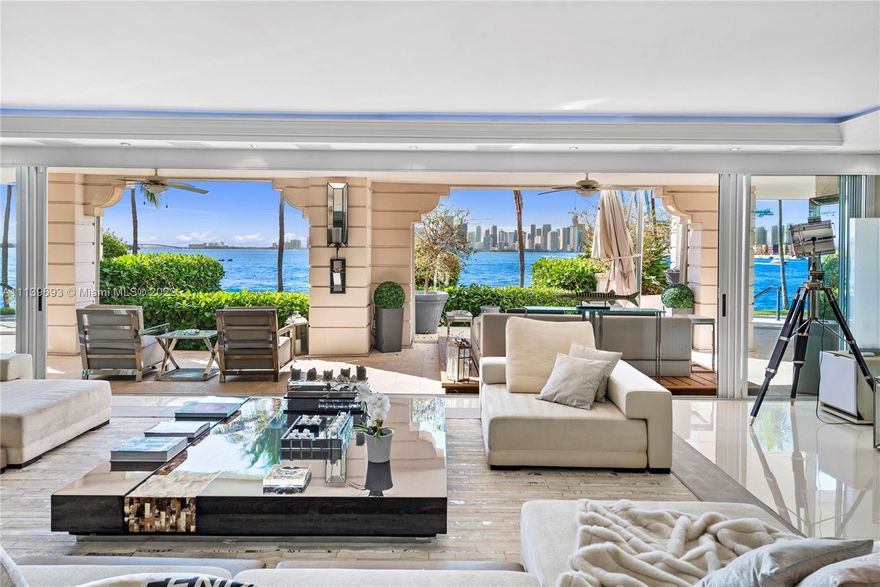 Experience Fisher Island living at it's finest in this stunning renovated ground floor Bayview unit. This one of a kind masterpiece encompasses 6,209 sq ft interior and 2,516 sq ft of expansive terraces overlooking the Miami downtown skyline and Biscayne Bay with breathtaking sunset views! This 5 bedroom, 5 bath + 2 powder room residence has been professionally designed with FENDI wallpaper and door panels throughout. The unit showcases: spacious open living room with a bar and formal dining, exquisite white porcelain & oak floors, a Chef's kitchen with top of the line appliances, an eat-in center island, a built-in surround sound system and many more features. Visit this exceptional fully furnished unit! Easy to show!