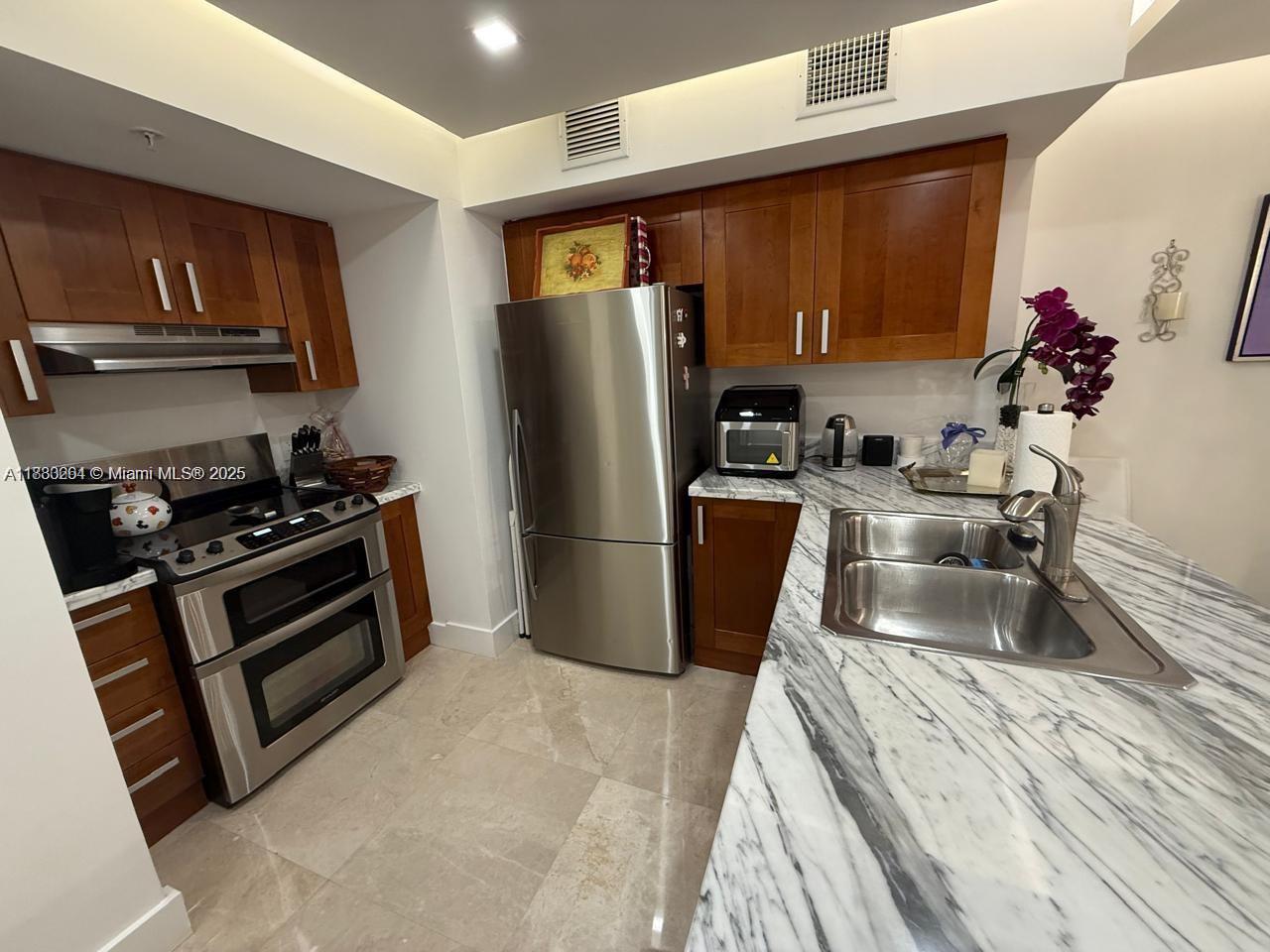 9499 Collins Ave 411