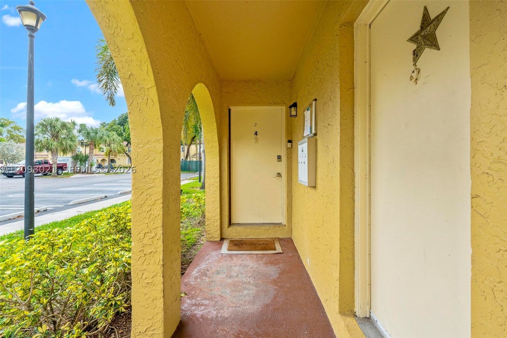 Photo of 10729 La Placida Dr #3-4, Coral Springs, FL 33065 (MLS # A12093021)