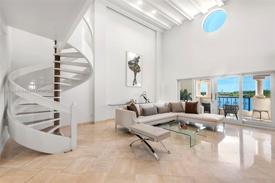 Visit this stunning two story Bayside Village Townhouse on Fisher Island overlooking Biscayne Bay and the Miami Downtown Skyline! Step into this spacious 20 ft+ ceiling condo with a skylight on a 4th floor, modern staircase, elevator, marble floors and terraces on the 1st and 2nd floor perfect for entertaining, a gourmet kitchen, impact glass doors and many more features.  Don't miss this exceptional offering!