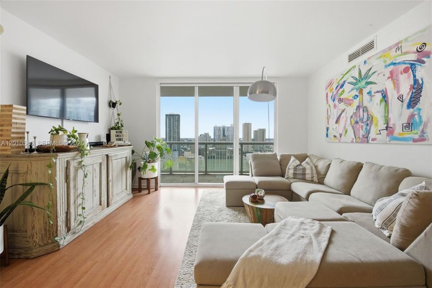 Experience elevated Downtown Miami living from this beautifully upgraded corner residence at iconic 50 Biscayne. This expansive 2 Bed/2 Bath showcases the coveted 11-Line floor plan and offers sweeping bay, skyline, and sunset views through floor-to-ceiling impact glass. The bright split-bedroom layout is complemented by contemporary flooring throughout and the line’s signature wraparound terrace, the largest 2-bedroom balcony in the building, framing Biscayne Bay, Bayfront Park, the skyline, and gorgeous sunset views. The open-concept kitchen features upgraded cabinetry, added storage, pull-out shelving, newer appliances, and sleek finishes, flowing seamlessly into generous living and dining spaces ideal for everyday comfort and entertaining. The oversized primary suite offers a spa-style bath with soaking tub, separate glass-enclosed shower, upgraded cabinetry, and ample closet space, while the guest suite enjoys privacy and direct terrace access. Additional highlights include electric blackout blinds throughout, upgraded washer/dryer, newer A/C, and smart thermostat. 50 Biscayne offers resort-style amenities including a modern fitness center, expansive pool deck with cabanas, BBQs and hot plunge, two resident lounges, business center, sauna, steam and massage rooms, valet, and 24-hour security. Short distance to Whole Foods, Silverspot Cinema, Kaseya Center, Bayfront Park, and Downtown Miami’s best dining and entertainment. Best-priced 11-Line available in the building.