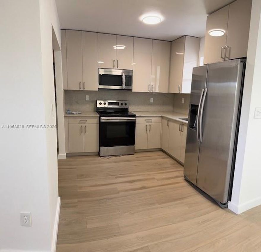 The 4 bedroom 2 full baths with den over 1400 sq feet a must see and is ready to move in with new roof and windows - updated baths and kitchen - - close to shopping and buses - 20 minute to beach -