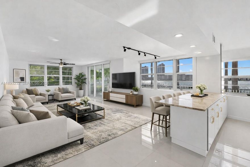 Welcome to this beautifully remodeled corner unit offering 1,693 sq ft of comfortable living space. This 2-bedroom, 2-bath home features a wrap-around balcony with serene Maule Lake views, porcelain tile floors, recessed lighting, and an updated kitchen and baths with granite countertops and stainless steel appliances. Located on the first floor, it offers easy access and hurricane protection with impact windows and sliding doors. Enjoy resort-style amenities including two pools, tennis courts, a fitness center, lush gardens, playground, and 24-hour security. Ideally located near restaurants, supermarkets, parks, Aventura Mall, beaches, and major highways—ready for you to move in and enjoy.