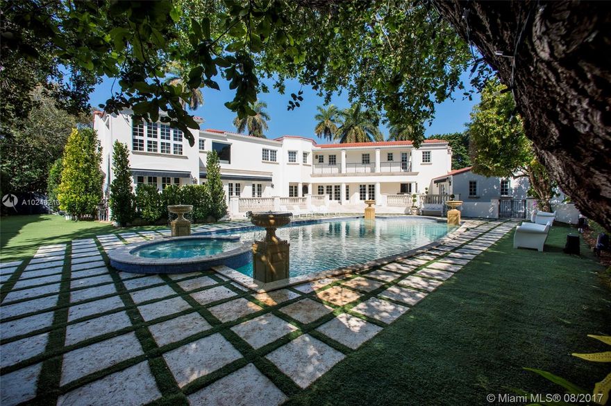 LA GORCE ISLAND GORGEOUS two-story manse with great curb appeal. 6 BR + DEN, 6 full baths + 2 1/2 baths on a 17K+ lot in an iconic Miami Beach gated community. Beautifully finished! Entertain in style w/ a huge pool, splendid deck for outdoor dining, library, formal dining room, living room & gourmet kitchen. Italian marble floors, chandeliers, venetian plaster & grand staircase leading to serene master bedroom designed by Holly Hunt + 3 garden-view bedrooms, 2-car garage + 4-slot carport. In-laws quarters with full bathroom can be accessed independently and gives the house great versatility. Must see!