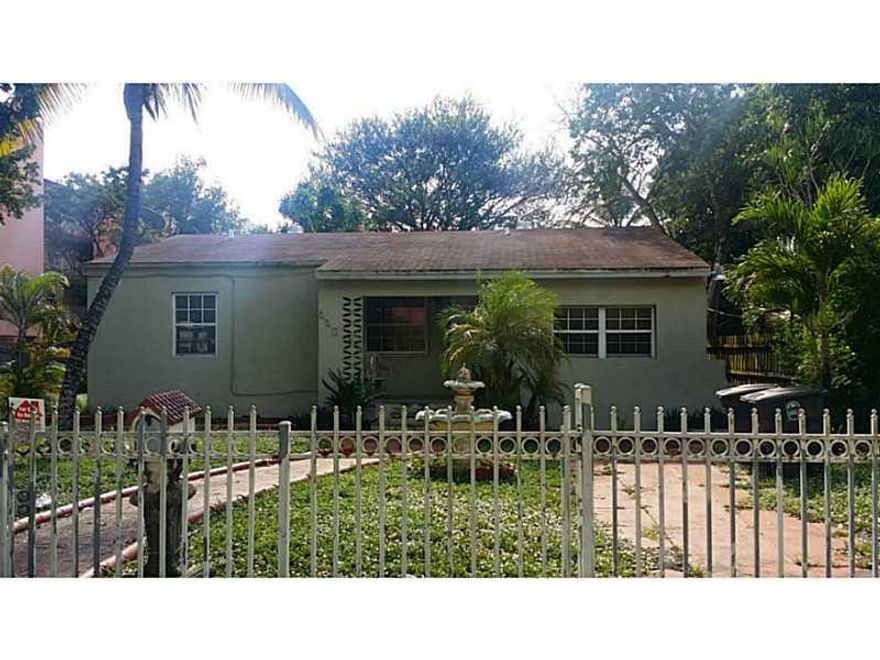 Well priced dream home or investment, in desirable Biscayne Gardens, sitting on a fenced-in 1/3 acre lot. The entrance has a lot of character, with custom iron bars and a nice setback. The interior needs some cosmetic updates, fully tiled and plenty of ro oms, open spaces and bright windows; a screened porch and even a basement. And finally a detached guest house in need of renovation. Main house can be rented at $1600 and guest house for $800. Great potential income!