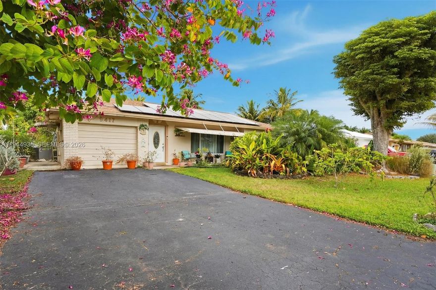 Welcome to your own slice of paradise in this waterfront, move-in ready 3-bedroom, 3-bath home located in a desirable 55+ community. Thoughtfully updated, this home offers the perfect blend of comfort, style, and relaxed Florida living.  Inside discover new tile flooring throughout and an updated kitchen with brand-new appliances, making everyday living both easy and elegant. The light-filled sunroom invites you to unwind while enjoying peaceful water views, creating the perfect space for morning coffee or evening relaxation. Outside, you’ll love the lush surroundings with an incredible variety of mature fruit trees—including banana, avocado, mango, guanabana, passion fruit, lemon, and more—bringing a true tropical feel right to your backyard. Impact windows provide added peace of mind, while the many recent updates make this home truly turnkey. Garage has been converted to a flex space is is currently being used as a 3rd bedroom. Residents enjoy access to a community pool and clubhouse, offering wonderful opportunities to connect, relax, and enjoy an active lifestyle. This waterfront gem is ready to welcome its next owner—come experience the comfort, beauty, and easy living that awaits you here. Updates include Roof (2022), A/C (2023), Water Heater (2022).  Mortgage savings may be available for buyers of this listing.  Ask Seller's Agent for more information.