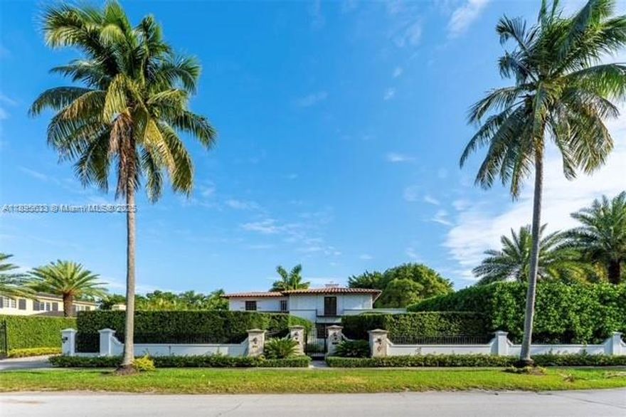 Prime Coral Gables home! Situated on prestigious North Greenway Drive, this historic 4-bedroom, 4-bath residence faces the scenic Granada Golf Course and rests on a sprawling 26,986 SF corner lot—the largest on the street. Originally designed by renowned architect William H. Merriam, this gated two-story home is surrounded by lush landscaping, offering privacy and timeless charm. Tenant occupied—please text listing agent to schedule a showing.