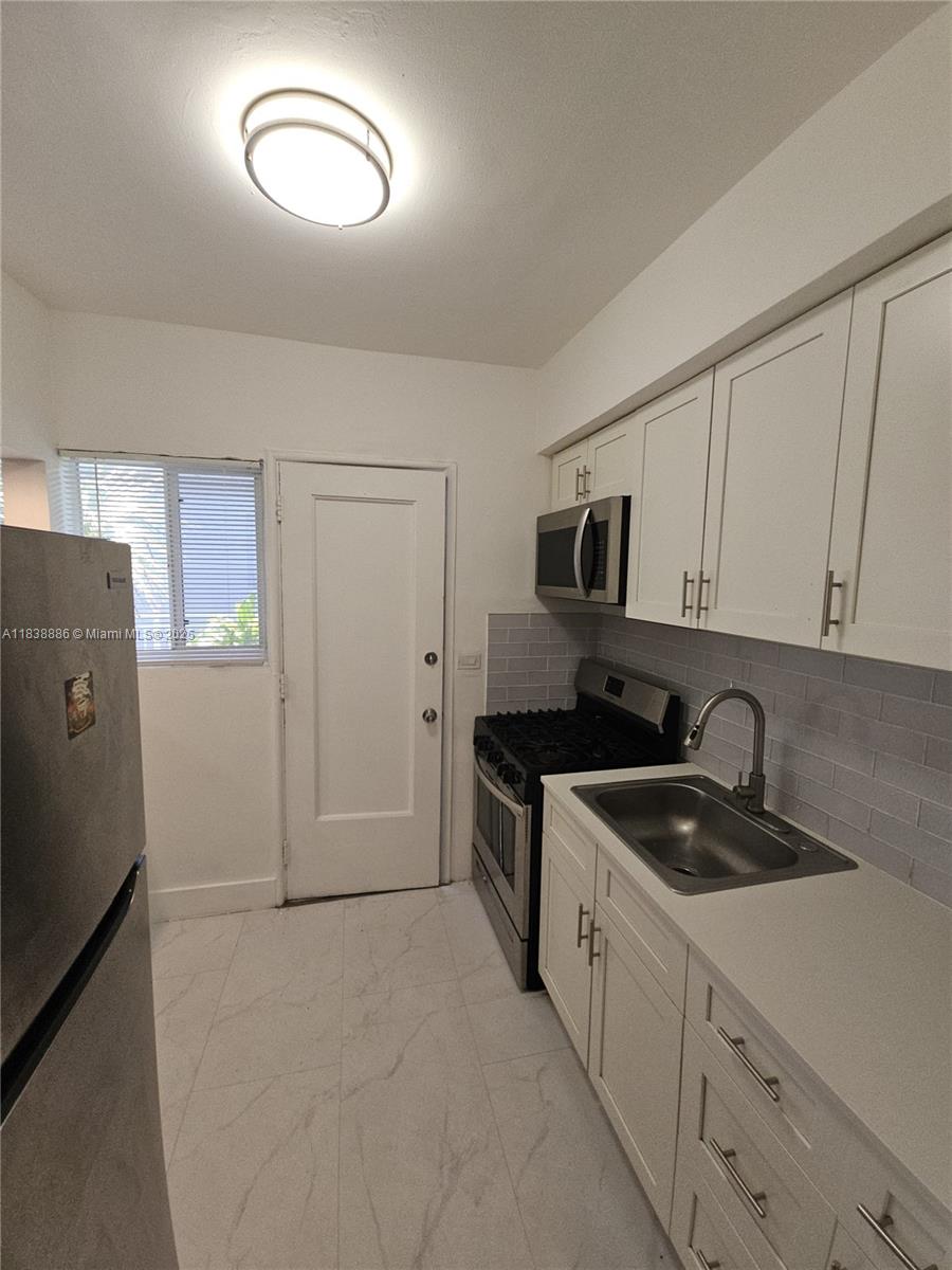 Location, Location, Location...Beautiful 1 + Den /1Bathroom completely renovated (quartz countertop), very comfortable. The apartment has been designed to maximize space and light with Private backyard. Washer/dryer on site. Great area! South Beach has the bustle, the energy, the vibrant sense of adventure — but only a few short miles away, North Beach has the relaxation and the escape.This private building is centrally located just a few blocks from the beach, major transportation, dining and entertainment. For Rent-AS IS: Cosmetic condition included.