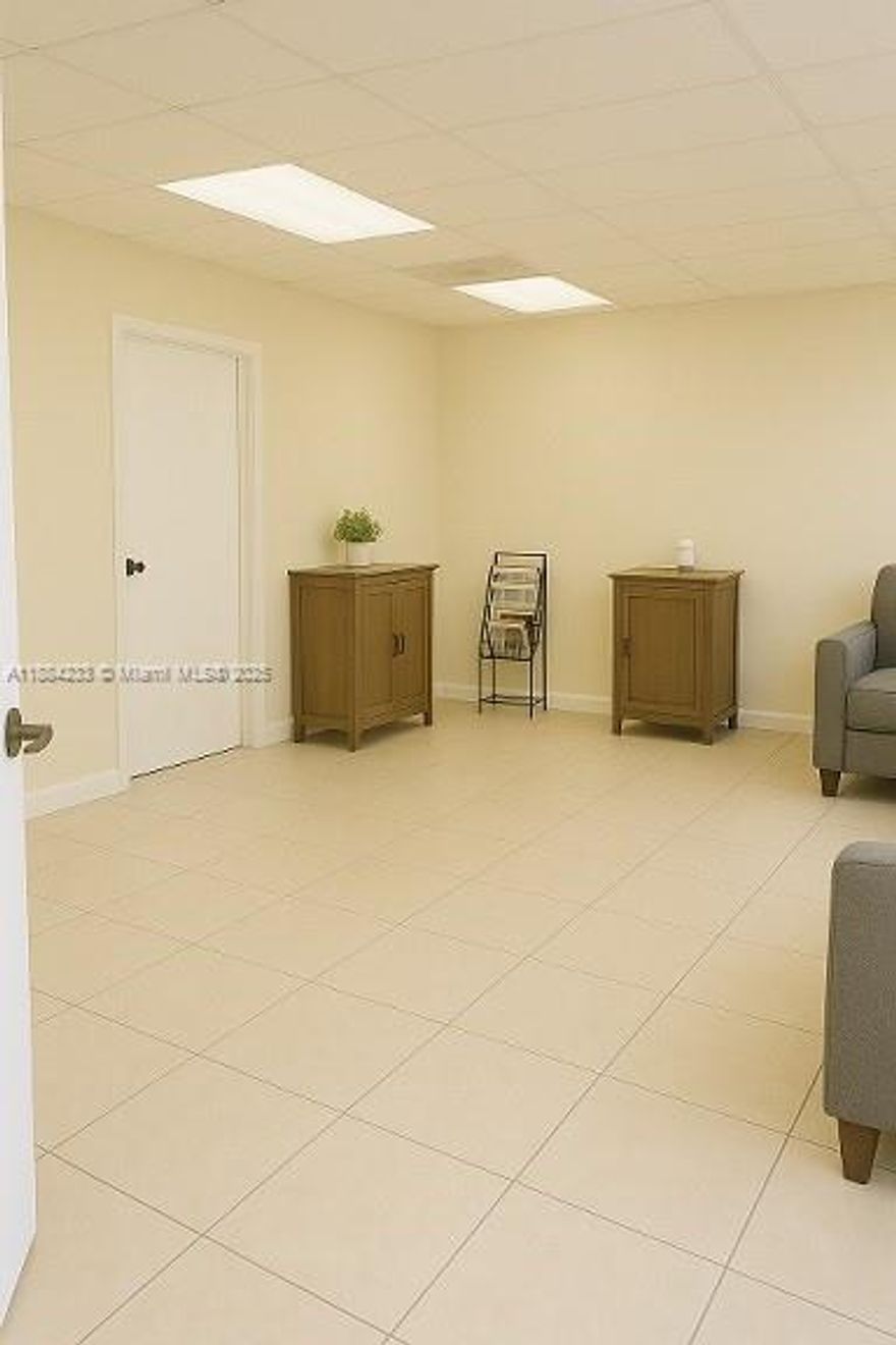 Office / Warehouse flex space near Tamiami Airport with convenient access to the 128th St Exit featuring a high   
 loading door in the back for easy access