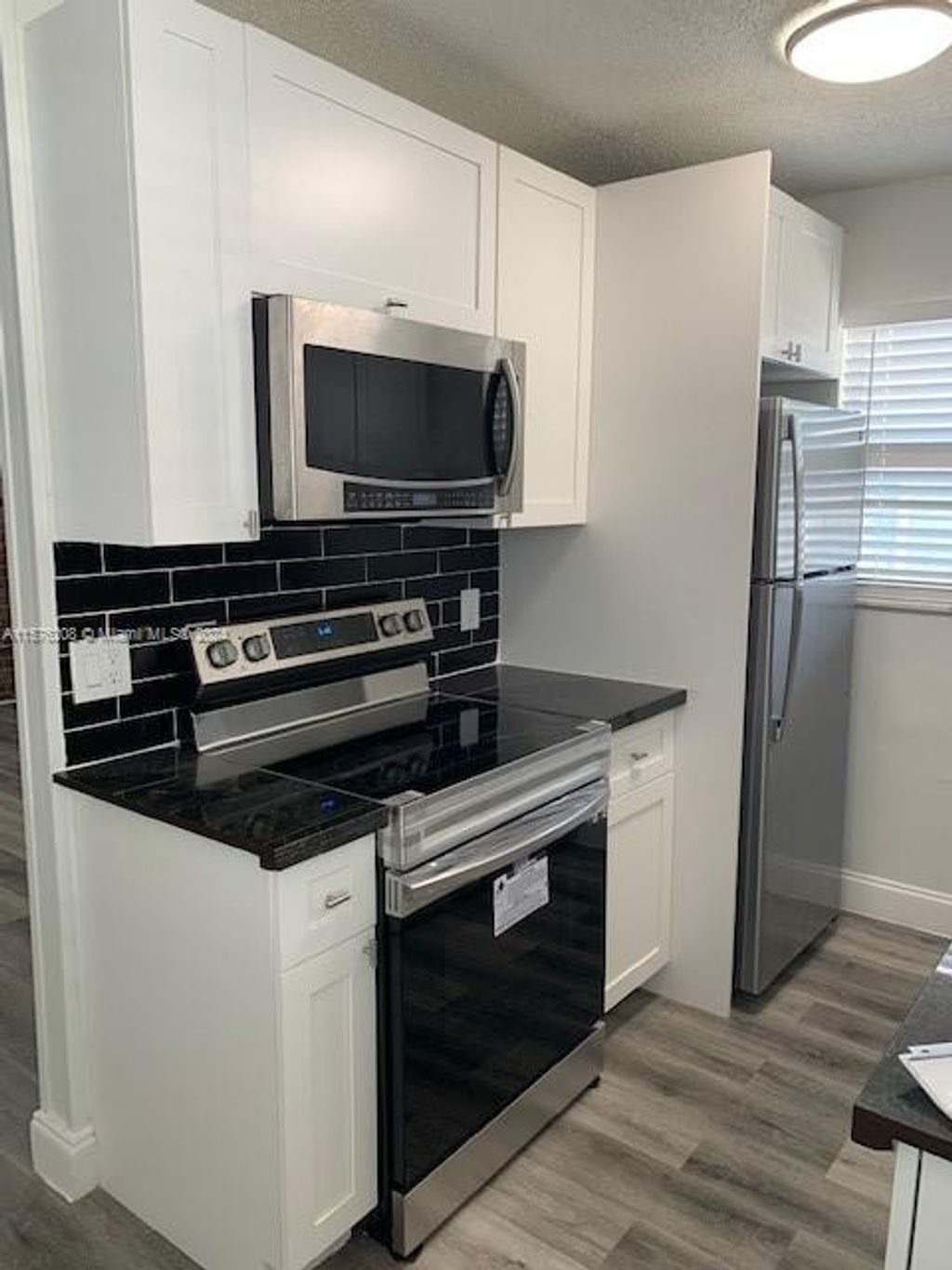 Photo of 405 SE 23rd Ave #C, Boynton Beach, FL 33435 (MLS # A11576208)