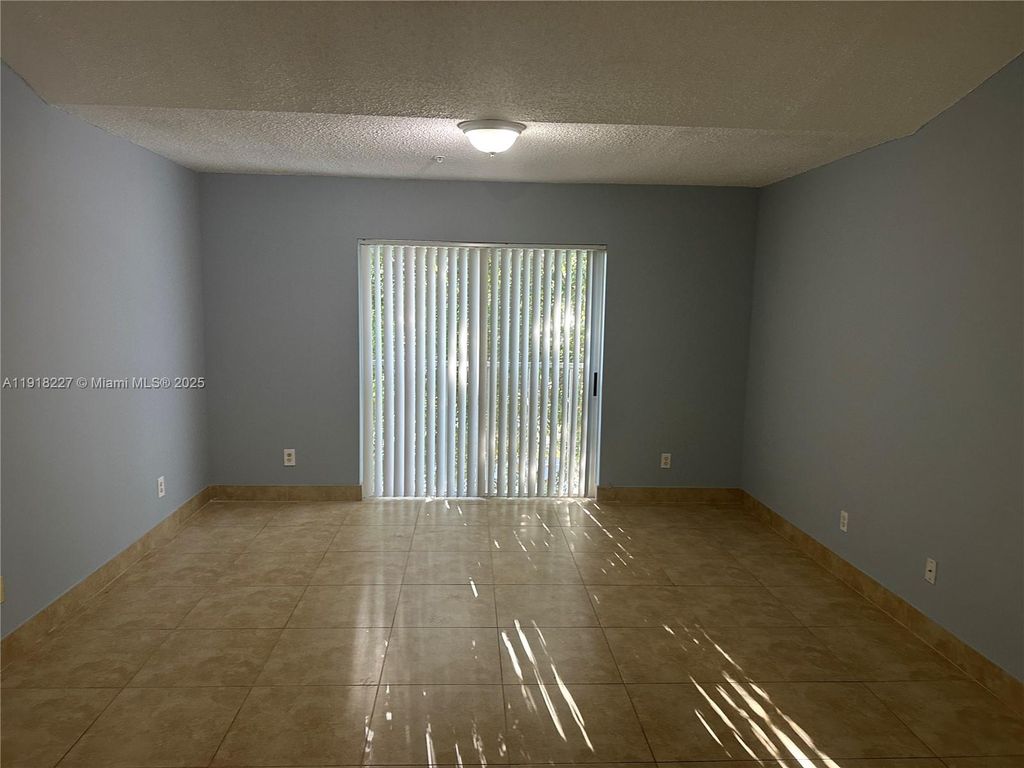 Photo of 9907 Westwood Dr #34-2, Tamarac, FL 33321 (MLS # A11918227)