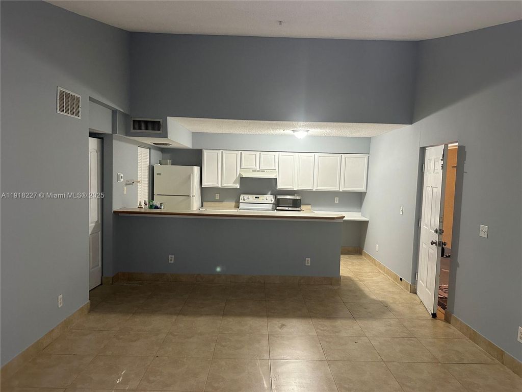 Photo of 9907 Westwood Dr #34-2, Tamarac, FL 33321 (MLS # A11918227)