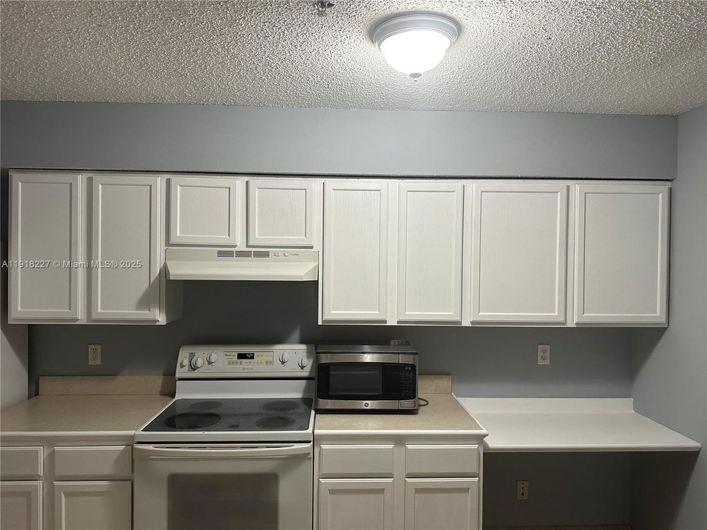 Photo of 9907 Westwood Dr #34-2, Tamarac, FL 33321 (MLS # A11918227)