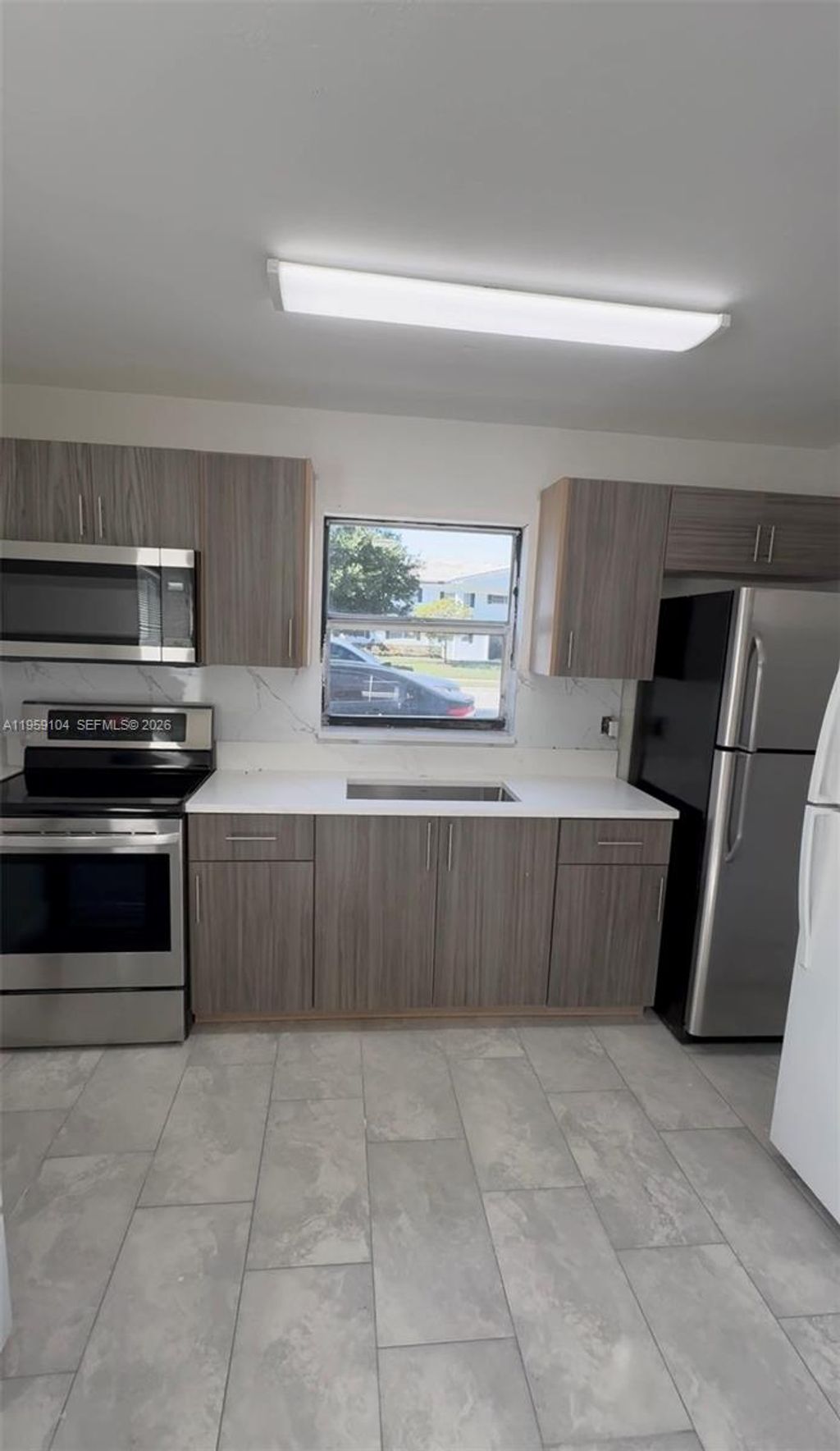 Photo of 4119 Woodside Dr #1, Coral Springs, FL 33065 (MLS # A11959104)