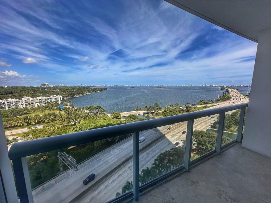 Incredible unobstructed Biscayne Bay and Miami Beach views from living room, kitchen, and bedroom!!! Faces East (North Miami Beach) & North. Open Kitchen, 1.5 baths, walk-in closet, sitting balcony, tile floor, quarts countertop, stainless steel appliances, washer/dryer in unit, semiprivate elevator foyer. Feel like your living in a resort with full amenities: infinity-edge heated pool, hot tub, business center, game room, BBQ area, movie theater, gym, sauna, steam room, convenience store, valet and 24-hour concierge. Situated walking distance to Design District, Wynwood, and Midtown, across the causeway to Miami Beach and I-95 to the airport.