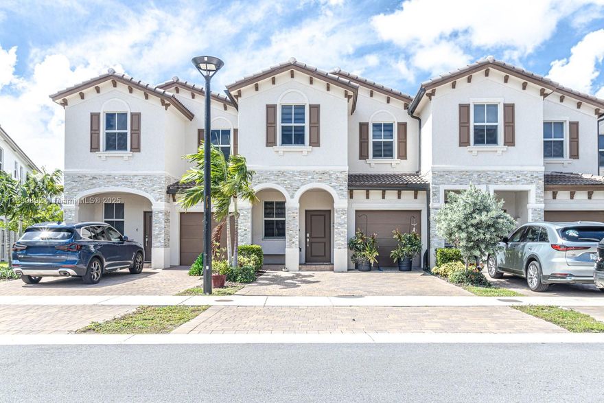 Newly built 3BD/2.5BA Townhome offering bright, modern interiors w/tile downstairs and carpet upstairs. Spacious master suite w/ walk-in closet, dual sinks & stand-up shower. Stylish kitchen w/stainless steel appliances, breakfast bar & open layout to living/dining area, enjoy a private backyard perfect for weekend BBQs and a fresh space for your furry friend! Plus a 1-car garage & space for 3 additional vehicles in the driveway - ideal for big families.The community is gated and spectacular, with a pool, jacuzzi, clubhouse, children's park, and pet area. Prime location; 7 min to I-95, 4 min to Miami Dade College- North Campus, Amelia Earhart Park, & 20 min to 826 Palmetto Expressway. Don’t miss this opportunity - you can own this townhome with a low down payment & flexible FHA financing.