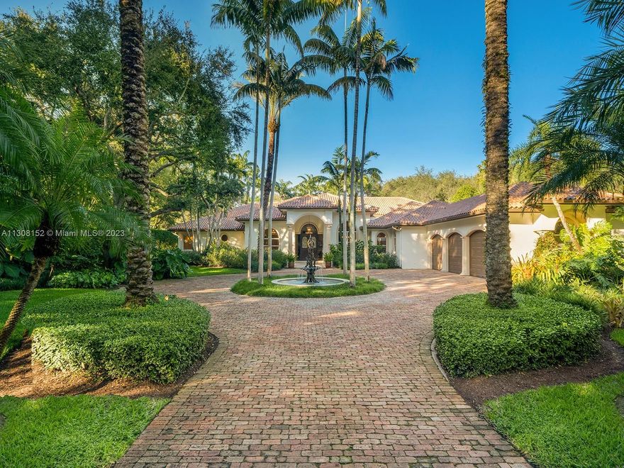 Elegance meets sophistication in the stunning one-story estate located on a quiet no-thru street in NE Pinecrest. This gorgeous home welcomes you w/ a foyer entrance, 14 ft volume ceilings & custom millwork. Discover expansive living areas including formal living & dining rms w/ direct views to the pool & manicured resort-like garden. Custom built designer kitchen w/ breakfast area, top-of-the-line appl & walk-in pantry. Huge master suite offers 3 WIC, sitting area, gym/studio rm, renovated spa like bath w/ custom cabinets & onyx finishes. Enjoy an outdoor oasis w/ covered terraces, Gazebo, fully equipped summer kitchen, ample yard, & exquisite heated pool/spa. Other features: temp-controlled wine rm, 3-car gar, generator, 1000 gal gas tank, wall & gated,
security cameras, 3 fountains.