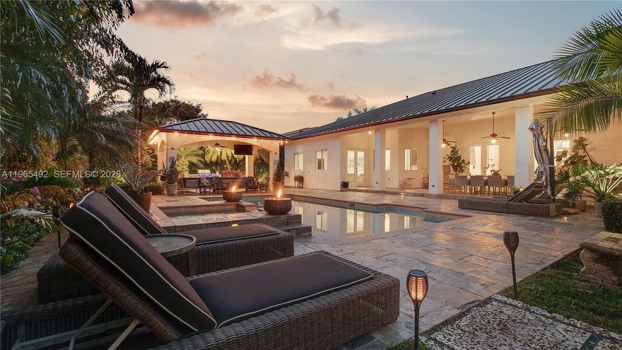 Now Repositioned at $2,599,000 – Best Value Opportunity in Palmetto Bay

Owner-built and thoughtfully upgraded, this expansive 6-bedroom, 5-bath residence offers soaring 14–16 ft ceilings and over 5,300 SF of living space designed for comfort and entertaining.

Major capital improvements provide long-term peace of mind: 2020 double-insulated dark bronze metal roof, impact windows throughout, matching bronze gutters, interior and exterior repaint (2020), two new A/C systems (2023), new pool pump (2024), and new sprinkler pump (2026).

The outdoor setting is a true highlight—gorgeous pool area surrounded by mature trees, coral rock fire pit, and a 2023 Paradise Grill outdoor kitchen with built-in refrigerator, ideal for gatherings year-round.

Located on a quiet, secluded street with a two-car garage plus additional front carport, this home offers privacy while remaining close to premier schools including Palmer Trinity and Westminster Christian.

Now strategically priced to reflect today’s market, this property presents a rare opportunity to secure space, quality construction, and lifestyle in one of Palmetto Bay’s most desirable locations.

Schedule your private tour today.