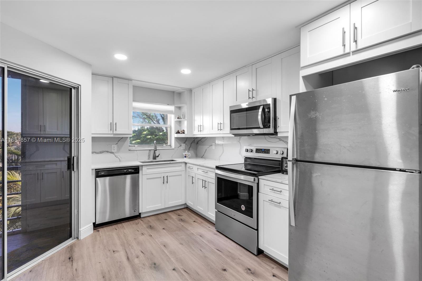 Discover comfort and ease in this beautifully renovated condo located in a vibrant 55+ community. Filled with natural light, the spacious layout features a full-size washer and dryer, custom soffit with LED lighting, walk-in closet, and peaceful garden views. Renovated in 2021 with modern upgrades throughout. Tuesday bbq at pool side and many fun events to help neighbors get to know one another better and reinforce existing relationships with friends and neighbors. Just minutes from the Turnpike, shopping, dining, and a short drive to the beach—offering the ideal blend of convenience and tranquility for your next chapter. SIRS + MILESTONE INSPECTION COMPLETED. Buyer's agent MUST be present at the time of showing.