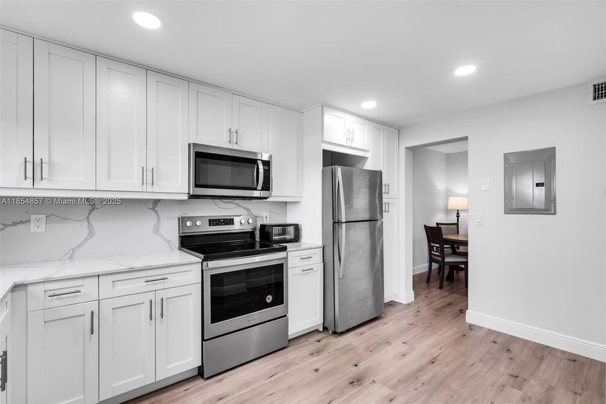 LOOK NO FURTHER! Discover comfort and ease in this beautifully renovated condo located in a vibrant 55+ community. Filled with natural light, the spacious layout features a full-size washer and dryer, custom soffit with LED lighting, walk-in closet, and peaceful garden views. Renovated in 2021 with modern upgrades throughout. Tuesday bbq at pool side and many fun events to help neighbors get to know one another better and reinforce existing relationships with friends and neighbors. Just minutes from the Turnpike, shopping, dining, and a short drive to the beach—offering the ideal blend of convenience and tranquility for your next chapter. Buyer's agent MUST be present at the time of showing.