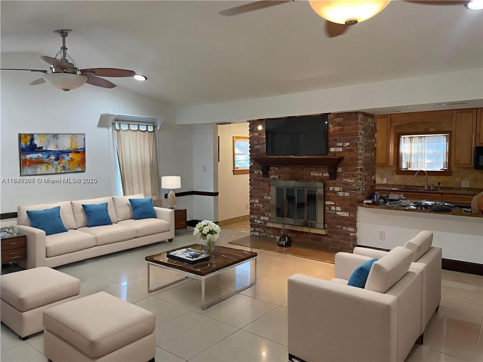 Large family home 3 bedroom / 2 bath 1/2 features a country style kitchen fireplace. The home is complete with porcelain tile floors, granite counter tops + Study/Den/Bedroom + remodeled baths & kitchen + a fantastic covered porch + backyard wood decking. Go up the spiral staircase and enter the self-contained 2nd bedroom. Close to everything Dania pointe , Dania beach , Fort Lauderdale airport.