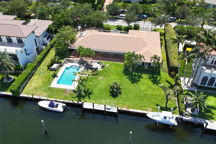 Located on a wide waterway with no bridges and a short boat ride to the open bay, this 20,300 square foot lot is the opportunity of a lifetime in guard gated Old Cutler Bay!  The existing 1-story 4 bedroom, 4.5 bathroom home spans 4,108 square feet and is an ideal rental property while you work on plans to expand or build new.  With approximately 139’ on the water, build your waterfront dream home in one of South Florida’s finest neighborhoods!