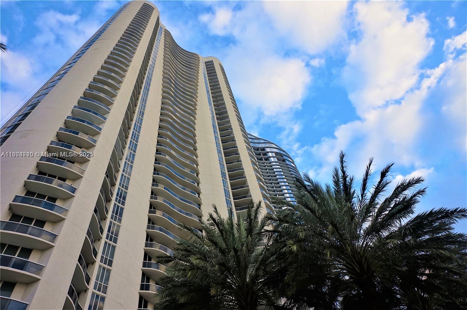 Resort-style living at Trump Towers III #2407. Bright and spacious 2-bedroom plus large den (convertible to 3rd bedroom, office, or family room) with 3 full ensuite baths and private elevator foyer. Features 10’ ceilings, white ceramic floors, an expansive balcony with direct ocean, Intracoastal, and city views. Italian-designed open kitchen with top-of-the-line appliances including Sub-Zero refrigerator, Miele dishwasher, wall oven, built-in coffeemaker, microwave, washer & dryer. AC is only 1 year old. The building offers 24-hour valet, a state-of-the-art fitness center, spa, and clubroom. Unit offered unfurnished.