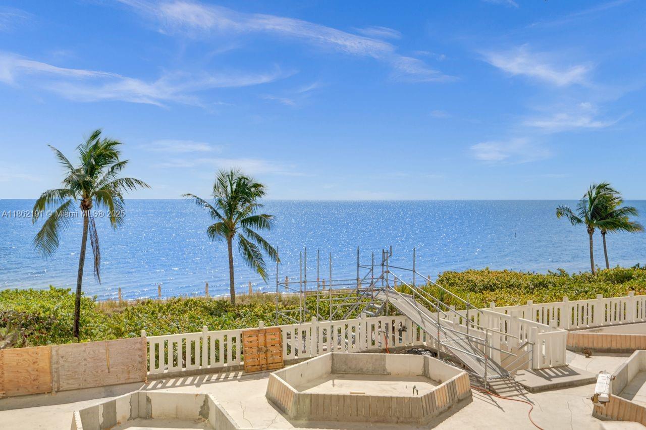 Oceanfront split-bedroom residence with direct ocean views from every room. Features an eat-in kitchen, ample closet space, and natural stone flooring throughout. Beautifully remodeled and equipped with impact-resistant windows and doors. Direct beach access. Easy to show.