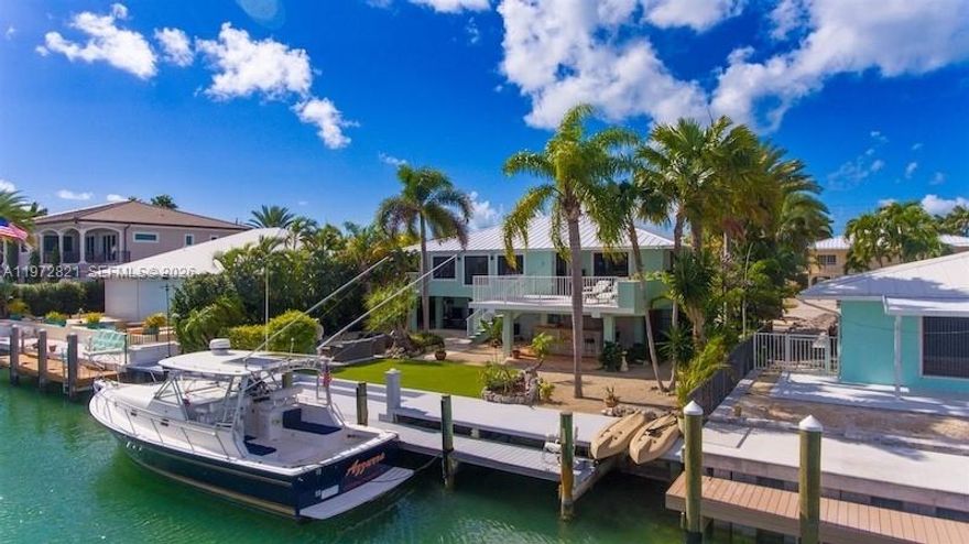 Welcome to an exceptional island retreat in the heart of Key Colony Beach. This beautifully elevated single-family residence embodies refined coastal luxury, offering 3 bedrooms and 2 bathrooms, additional space with no detail overlooked. Thoughtfully renovated, the home features a new metal roof, impact-rated windows and doors, elegant LVT flooring, designer lighting, custom cabinetry, and exquisite Cambria quartz countertops throughout. Outdoors, the property transforms into a private resort. Lush tropical landscaping and ambient exterior lighting set the tone, while an outdoor shower, custom bar, and sparkling pool create the perfect setting for entertaining or unwinding in complete privacy. Boating enthusiasts will appreciate 75 feet of concrete dockage with a composite step-down system, seamlessly blending function with style. An expansive, titled upper deck offers a sophisticated space for gatherings, sunset cocktails, and elevated island living. Ideally positioned just moments from the iconic Sunset Park, this residence delivers a rare combination of luxury, lifestyle, and location. A truly turnkey opportunity to own a distinguished piece of paradise in Key Colony Beach. Schedule your private showing today.