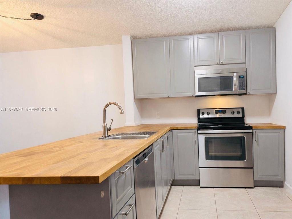 Photo of 614 Woodgate Cir #C, Sunrise, FL 33326 (MLS # A11977932)