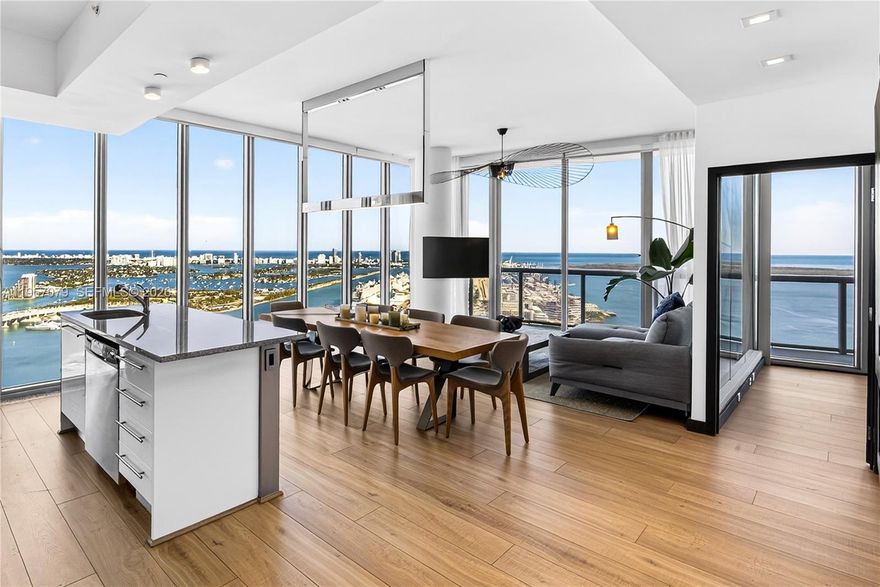 Experience Marina Blue’s coveted 08 line, known for its sweeping, unobstructed views spanning Sunny Isles, Miami Beach, Key Biscayne, Edgewater, Brickell, and Downtown Miami. One of only three residences crowning the building’s uppermost waterfront tier, this high-floor home offers a rare panoramic vantage point seldom available.

Featuring 10-foot ceilings, the residence has been thoughtfully updated with brand new flooring and a refined floor plan designed to enhance the living area and fully capture its panoramic exposure. The home offers 2 bedrooms, 2 baths, floor-to-ceiling glass, electric blackout shades, in-unit washer and dryer, and stunning water and skyline views from every room. An additional west-facing balcony provides sunset and city light views.

Ideally located across from Kaseya Center and one block from Miami Worldcenter, dining, shopping, and the Apple Store. Marina Blue offers resort-style pools, fitness center, business center, jacuzzi, BBQ areas, mini market, and CVS on site.

A limited opportunity for the next fortunate owner at the architectural apex of the 08 line.